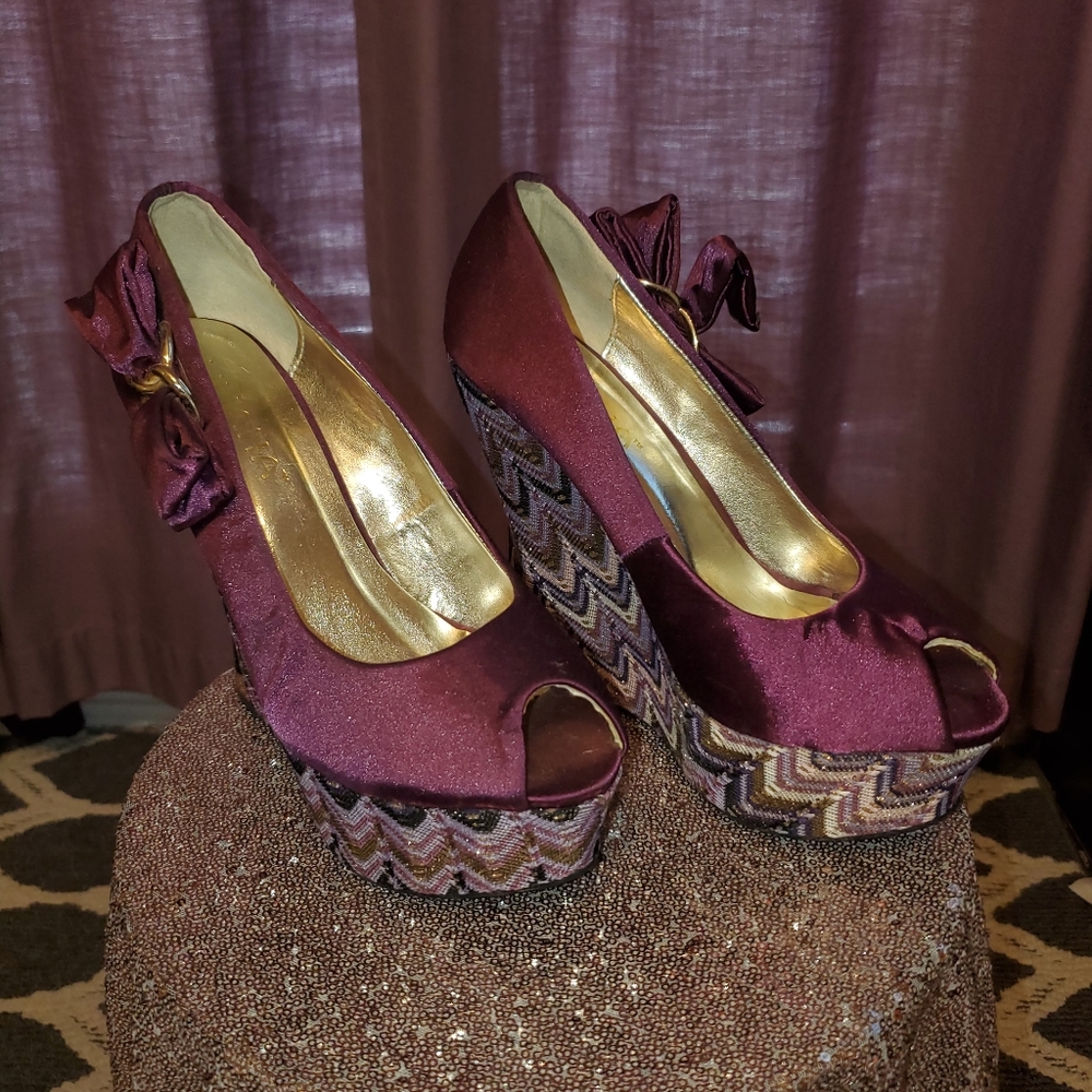 Purple satin wedge shoes.